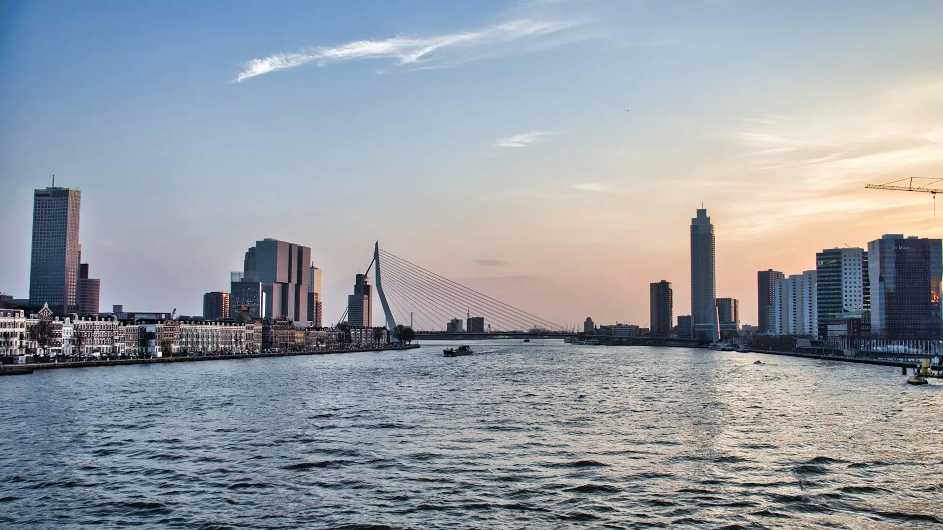 a body of water with a city in the background